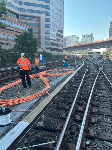 Crews pull cable along tracks near Silver Spring.