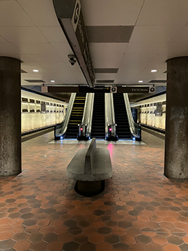 A picture of escalators on the Lower Platform of the L'Enfant Plaza Station. These escalators lead to the Greenbelt side of the Upper Platform.
