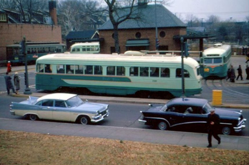 Historic bus terminal with green buses